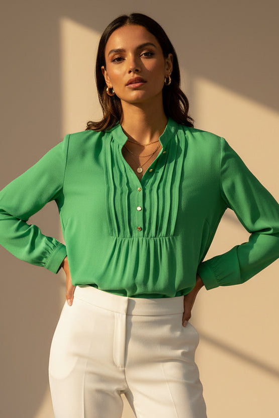 Green blouse with buttons on a white background