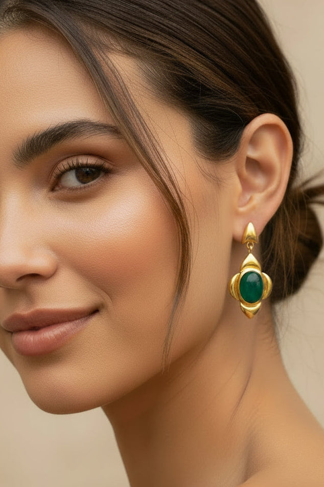 Gold statement earrings with green stones
