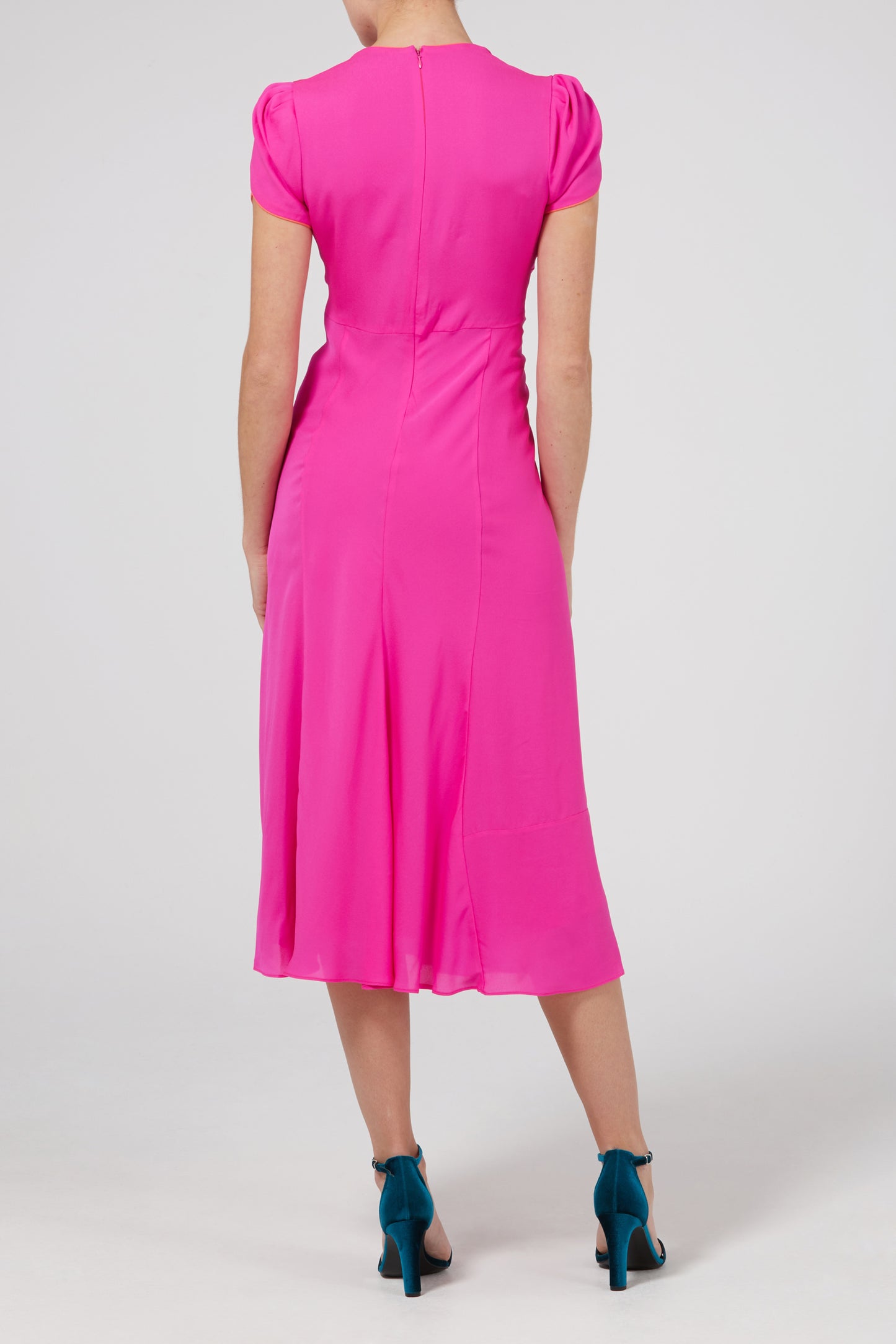 Full length back view of elegant hot pink occasion dress by Libélula Studio