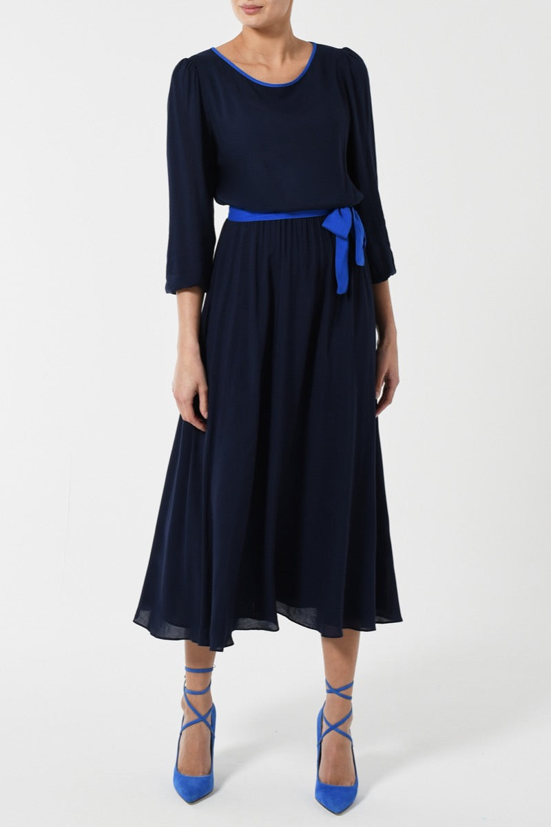 Our Midi JoJo Dress in Plain Navy Rayon with a vibrant royal blue belt and neck detailing Libelula Our Midi JoJo Dress in Plain Navy Rayon with a vibrant royal blue belt and neck detailing Libelula