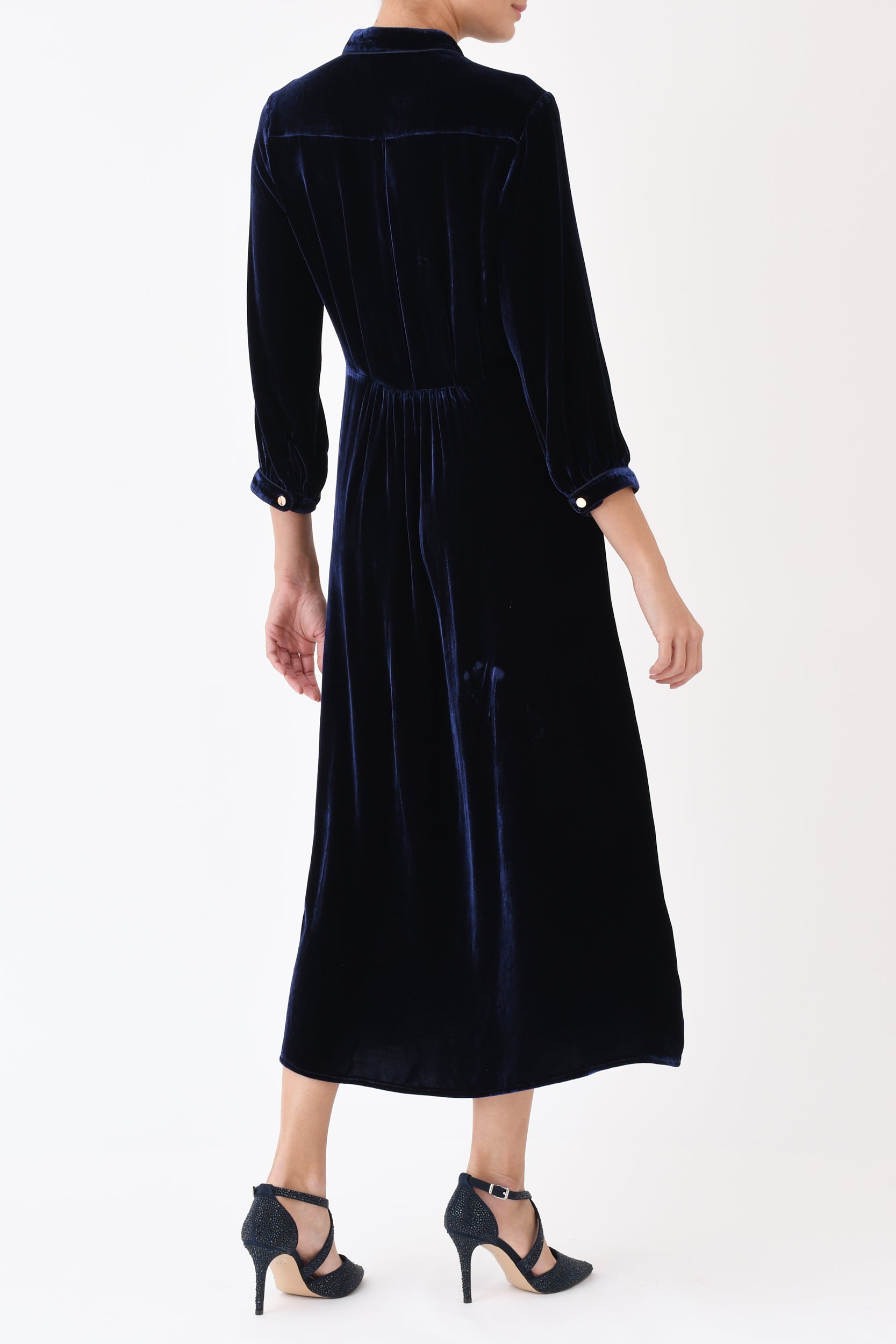 Navy velvet Anastasia dress side view showing flattering silhouette