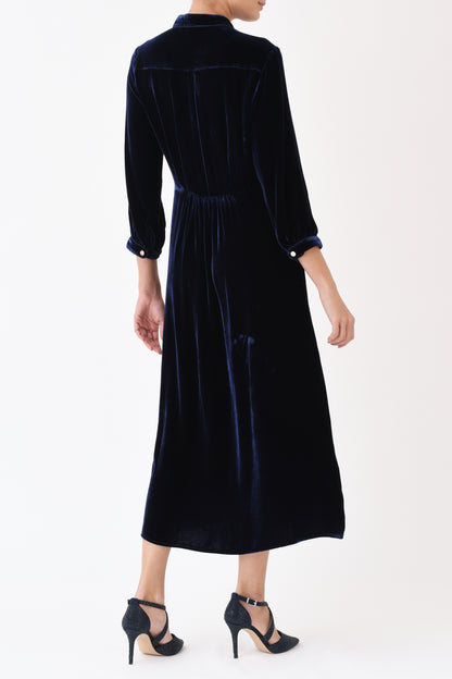 Navy velvet Anastasia dress side view showing flattering silhouette